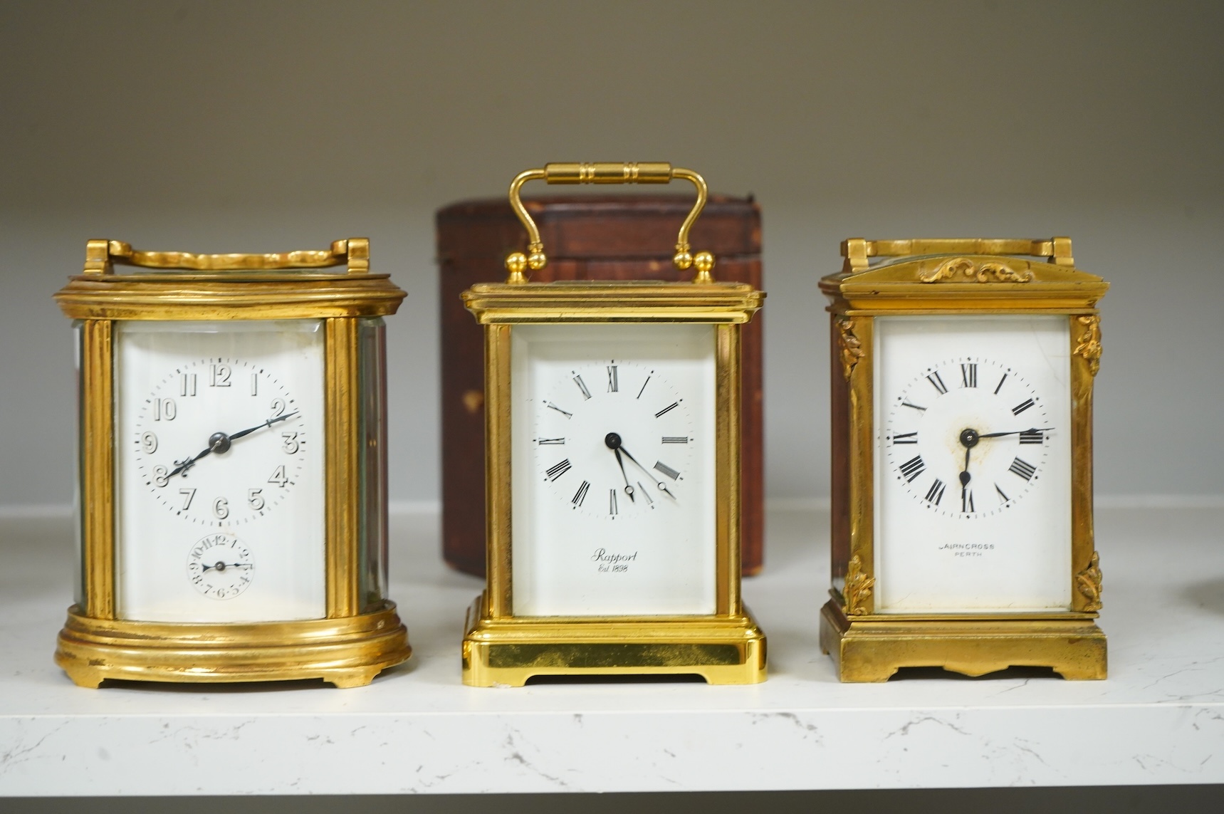 Two carriage clocks and a timepiece, tallest 12.5cm
